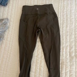Lululemon dark green leggings- lightly worn. Size 6.